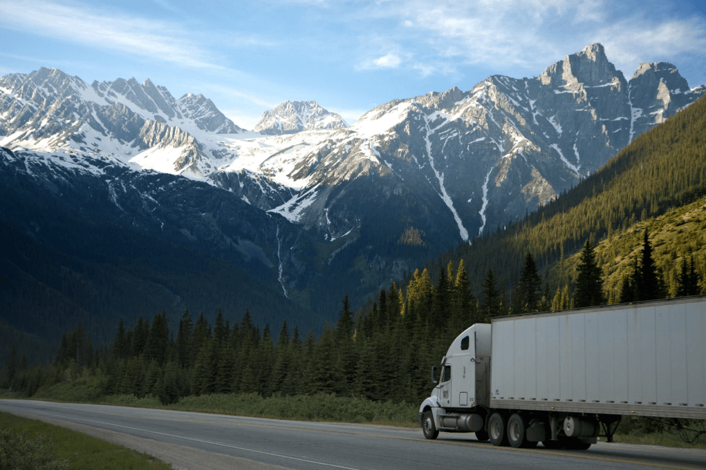 Semi-truck on a mountain road.